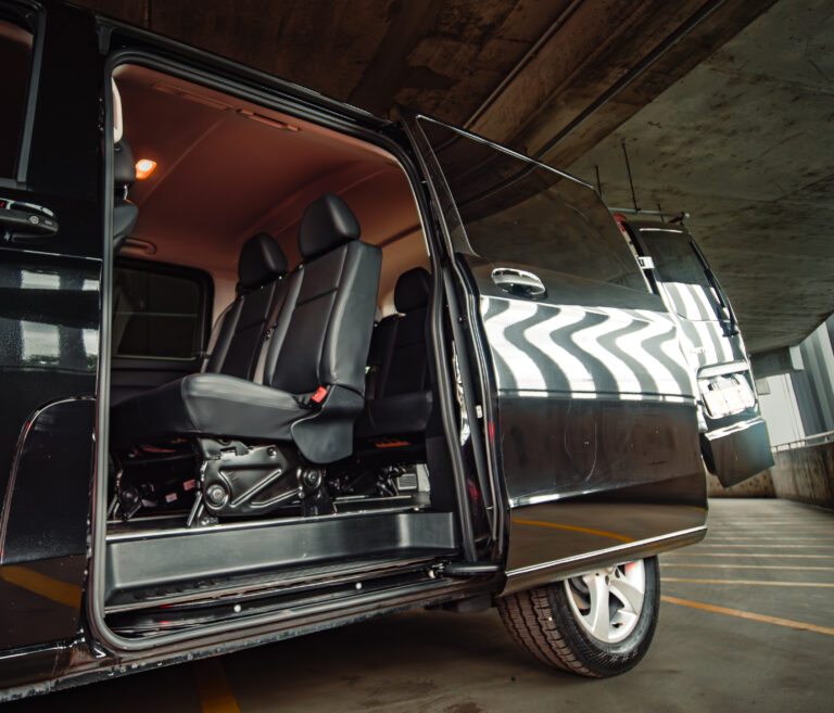 Passenger seats of a Mercedes-Benz Metris imported from the USA, seen through the open sliding door